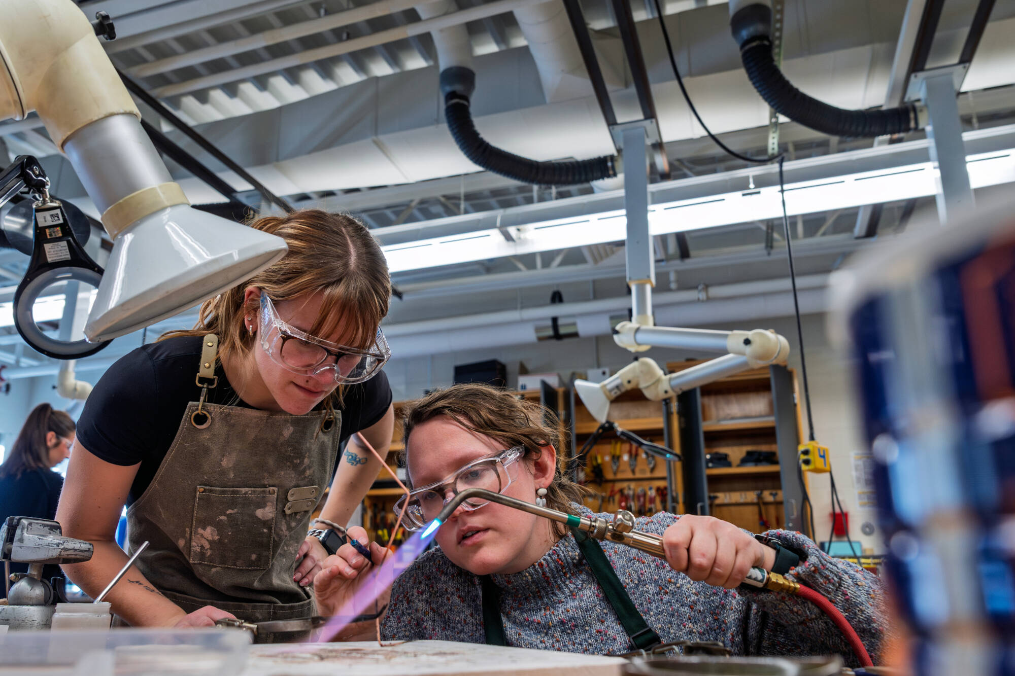 two students working in metal class